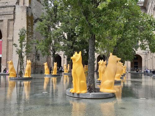 a group of cat statues in a courtyard at Parmigianino Nove in Parma
