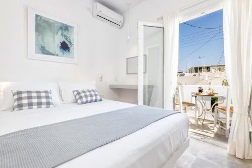 Postel nebo postele na pokoji v ubytování Pelican Paros