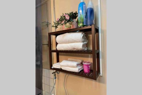 a towel rack with towels on it in a bathroom at Olivia apartment Porvoo in Porvoo