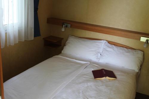 Katil atau katil-katil dalam bilik di Agriturismo Al-Bor