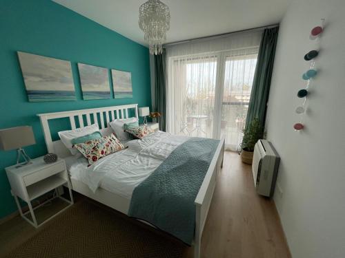 Posteľ alebo postele v izbe v ubytovaní Vízpart Hullám Apartman