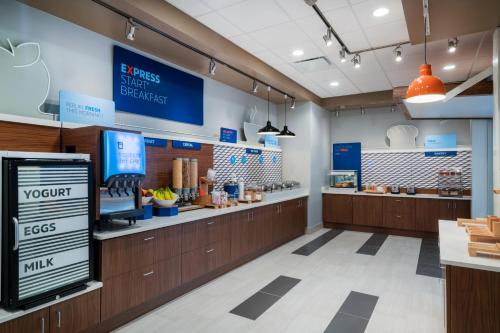 a grocery store with a cash register and a food counter at Holiday Inn Express & Suites - St Peters by IHG in Saint Peters