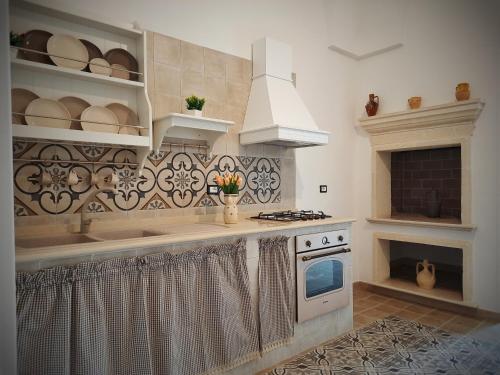 Η κουζίνα ή μικρή κουζίνα στο Casa Vacanze Lu Cumentu