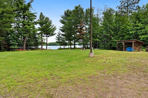 a pole in a field with a gazebo at Grand Tomahawk Lodge in Tomahawk