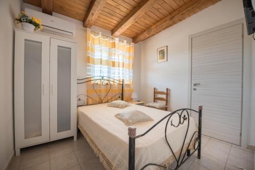 Postel nebo postele na pokoji v ubytování templi la piscina