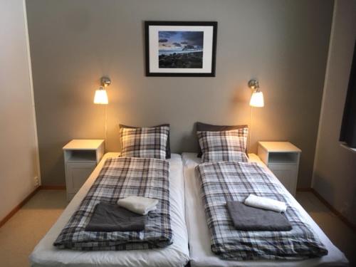 a bedroom with two beds with pillows on them at House in the heart of Lapland P4 in Puoltikasvaara