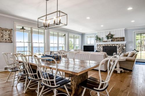 a dining room and living room with a table and chairs at Summer Breeze in Sayner