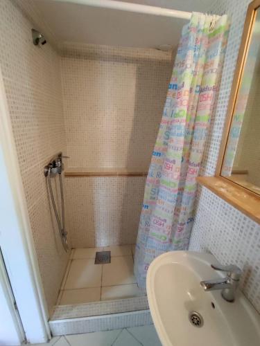 a bathroom with a shower and a sink at Apartment Valun 60 in Valun