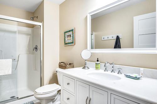 a bathroom with a sink and a toilet and a mirror at Summer Breeze in Sayner