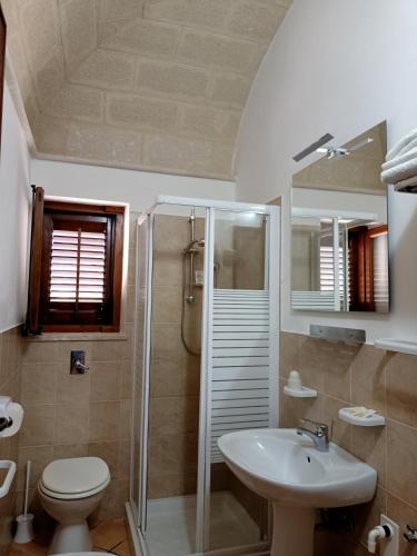a bathroom with a toilet and a sink and a shower at Case Vacanze Mariposa in Favignana