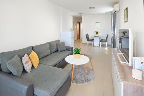 a living room with a couch and a table at Villa Ivano in Makarska