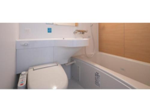 a bathroom with a toilet and a sink and a tub at R&B Hotel Nagoya Ekimae - Vacation STAY 38769v in Nagoya