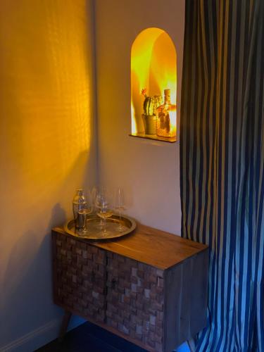 a room with a table with wine glasses on it at Santafe' in Vietri sul Mare