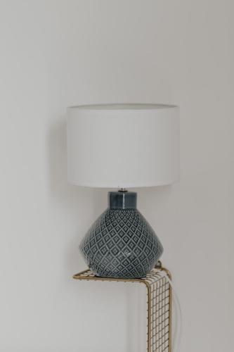 a lamp sitting on top of a shelf at Pausa Mare Apartment in Polignano a Mare