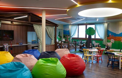 a room with colorful bean bags on the floor at Bella Gramado in Gramado