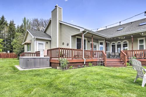 a house with a large deck and a yard at McMinnville Wine Country Home with Hot Tub and Deck in McMinnville
