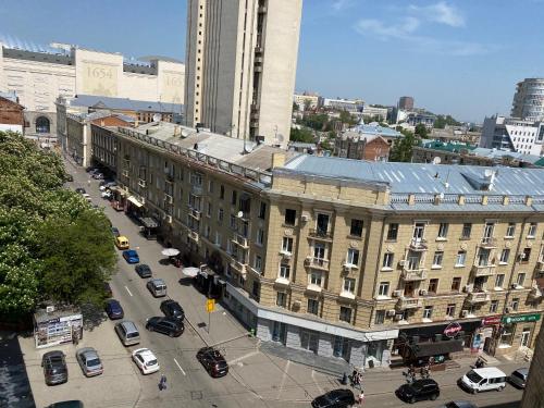 an overhead view of a city street with cars parked at Panorama Luxury Apartment in The House with a Spire, a historical building in the city centre in Kharkiv