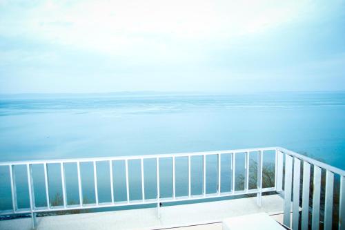 a view of the ocean from a balcony at Club 218 Wellness Luxus Apartman in Siófok