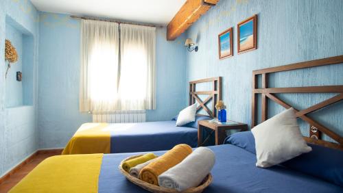 Un pat sau paturi într-o cameră la Casa Rural Santa Elena