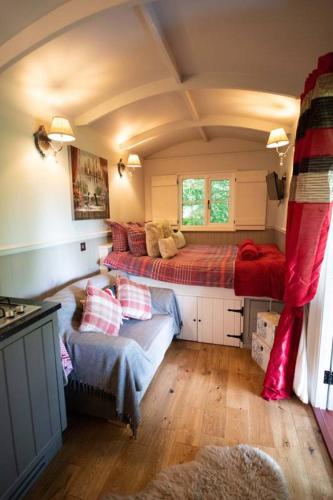 a bedroom with two beds and a couch in it at Thompson Hall Retreat in Thompson
