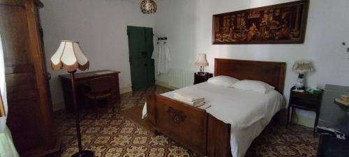 Säng eller sängar i ett rum på Villa Fontilha