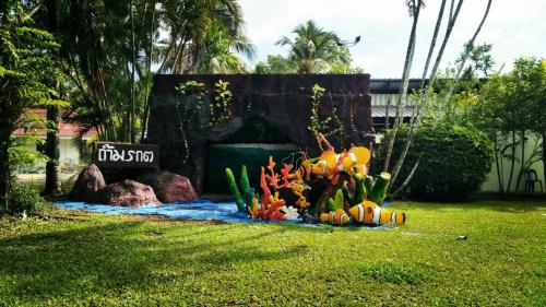 a display of fish in a garden in a yard at LayTrang Pakmeng Marina Spa and Resort in Trang