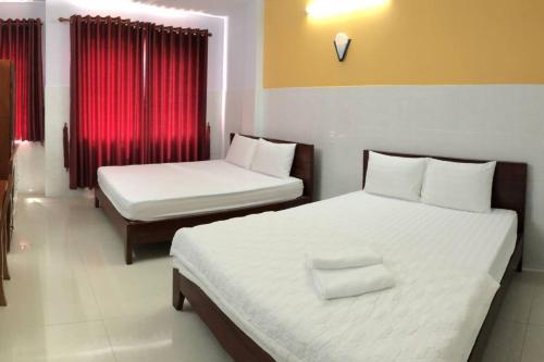 Una cama o camas en una habitación de Thadico 3 Hotel