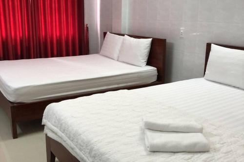 Una cama o camas en una habitación de Thadico 3 Hotel