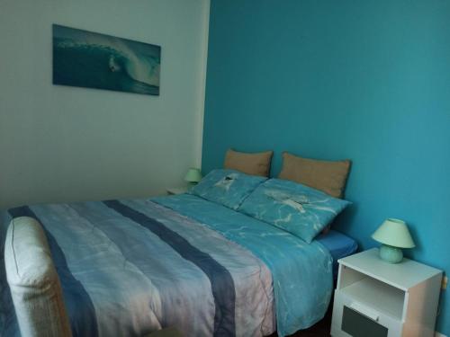 En eller flere senge i et værelse på Casa Roby 120 mt Beach