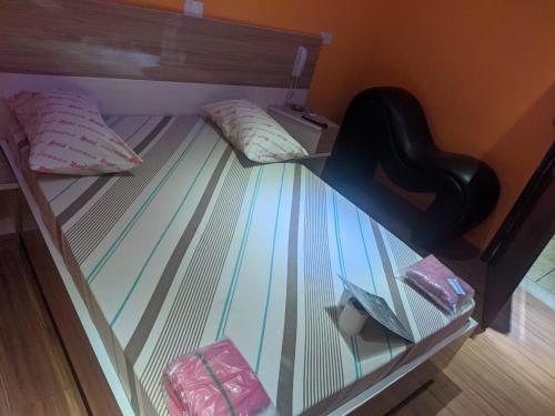 a bunk bed with two pillows and a glass shelf at Hotel Santos in Santos