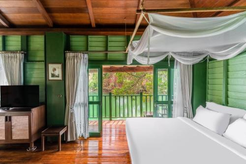 Postel nebo postele na pokoji v ubytování AANA Resort & Villas Koh Chang