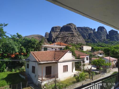 a small village with a mountain in the background at Spartacus House in Kalabaka