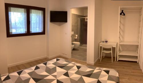 a room with a black and white checkered floor at AI QUATTRO SOLI in Privano