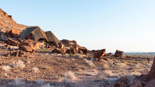 an old building in the middle of the desert at Twyfelfontein Country Lodge in Twyfelfontein
