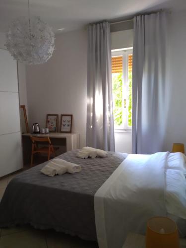 Postel nebo postele na pokoji v ubytování M. BINI B&B