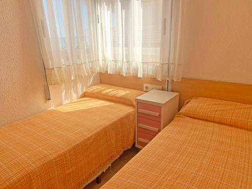 Postel nebo postele na pokoji v ubytování Apartamento Papa Luna Primera Línea 3000