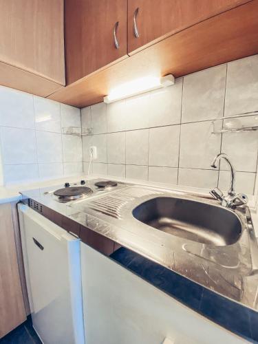 Kuchyňa alebo kuchynka v ubytovaní Vanilia Apartman By BLTN Siófok