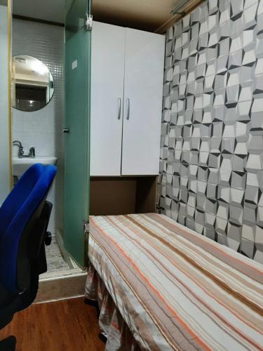 a small room with a bed and a sink at Bestel Residence in Seoul