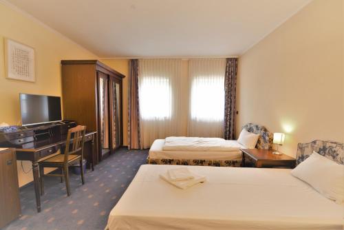 Postel nebo postele na pokoji v ubytování LandhotelUllrich