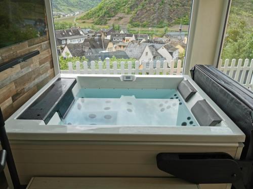 a hot tub in a window with a view at Anitas Ferienhaus in Cochem