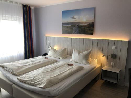 En eller flere senge i et værelse på MarC5 Hotel Cadenberge