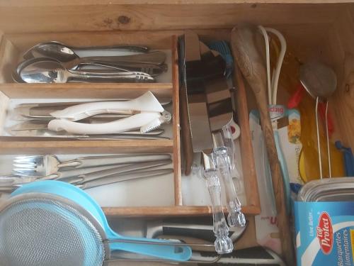 a drawer full of utensils in a kitchen at Ideal Appart Ain Zaghouan Tunis in El Aouina