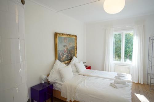 Postel nebo postele na pokoji v ubytování Skärva Herrgård