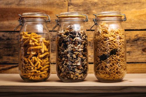 three glass jars filled with different types of seeds at Lagoon Attitude (Adults Only) in Cap Malheureux