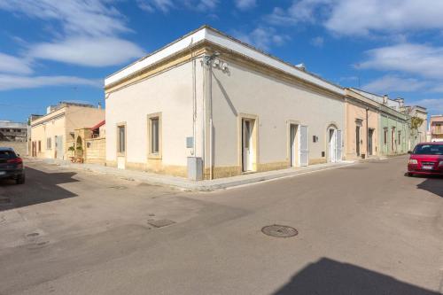 a white building on the side of a street at Salento Ada's House in Melendugno