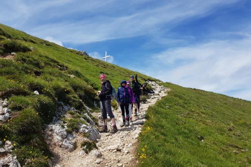a group of people walking up a hill on a trail at Theresienhof in Petschnitzen