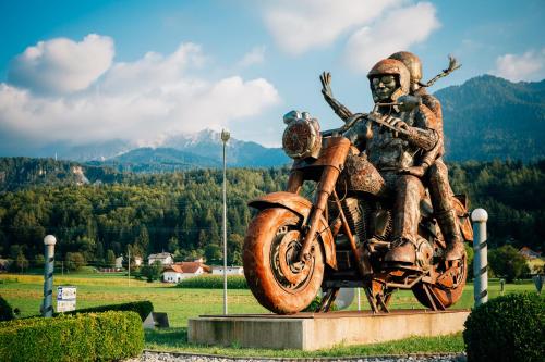 a statue of a man on a motorcycle at Theresienhof in Petschnitzen