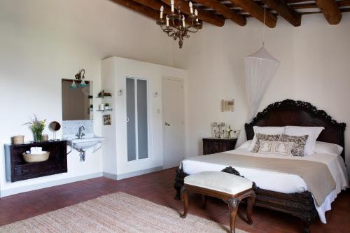 a bedroom with a bed and a sink in it at B&B Can Casadella in Premia de Dalt