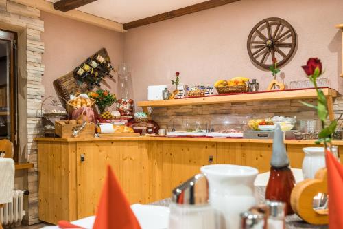 a bakery with a counter with food on it at Haus Stüttler/Duchscherer in Schruns-Tschagguns