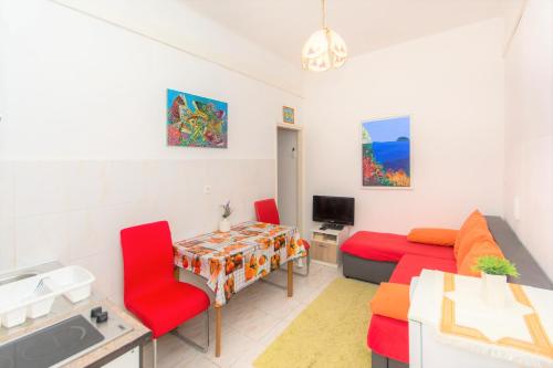 a living room with a couch and a table at Dubrovnik center apartment in Dubrovnik